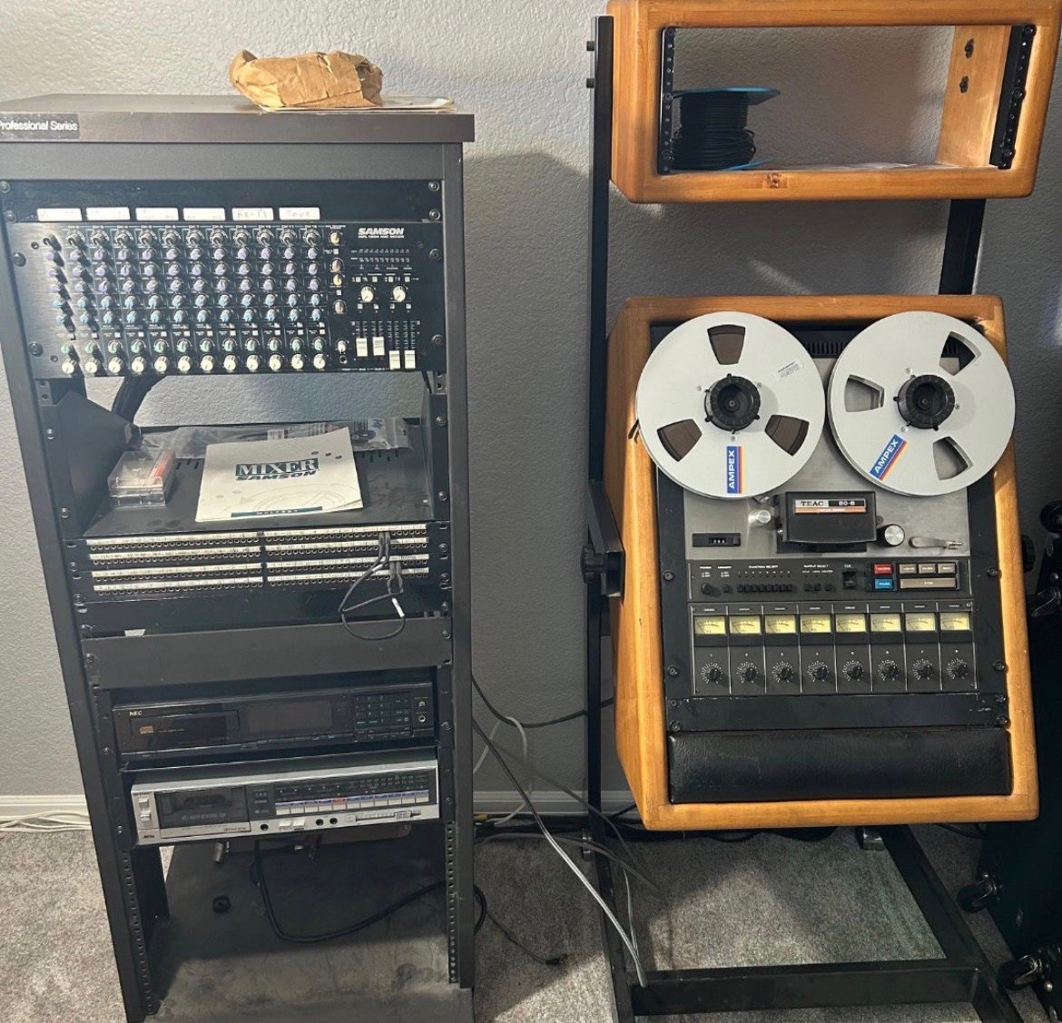Vintage audio rack with mixer, cassette deck, and reel-to-reel tape recorder from a Colorado estate